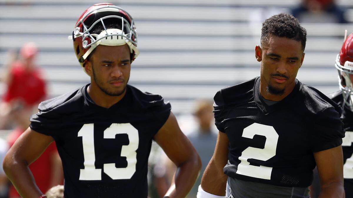 Alabama quarterbacks Jalen Hurts (2) and Tua Tagovailoa (13) runs drills during an Aug. 4 practice, in Tuscaloosa, Ala. Alabama enters game week with no answer, publicly at least, to the question of who will start at quarterback against Louisville.