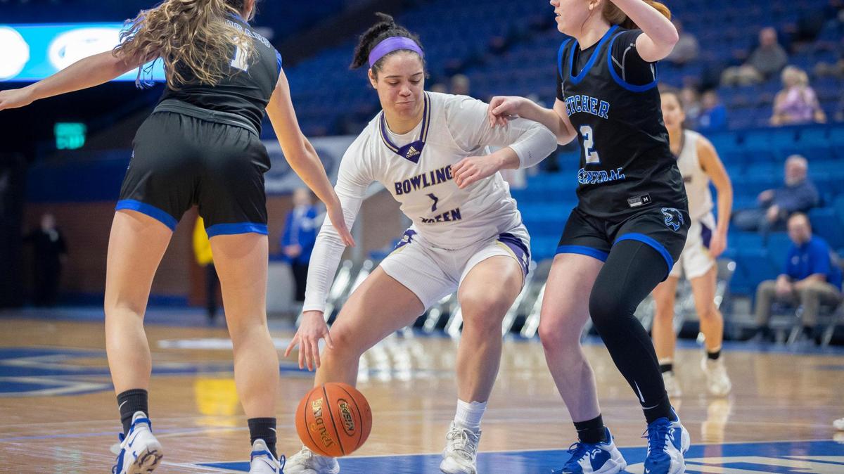 Bowling Green’s Meadow Tisdale (1) drives the ball as Letcher County Central’s Tori Holcomb (1) and Letcher County Central’s Keira Couch (2) play defense during the 2022 Mingua Beef Jerky Girls’ Basketball Sweet 16 at Rupp Arena in Lexington, Ky., on Thursday, March 10, 2022.