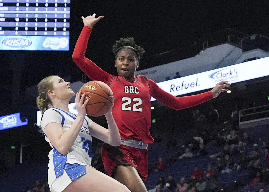George Rogers Clark’s Eliyah Strode goes for a block on Franklin-Simpson's Reece Mylor during the Clark’s Pump-N-Shop Girls’ Basketball Sweet 16 quarterfinals at Rupp Arena on Friday.