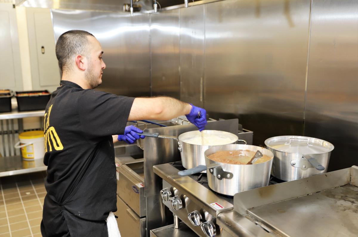 Jose Gomez of Bandido Taqueria Mexicana, prepared queso dip, beans, and rice for the soft opening of the new Southern California-style restaurant located at 535 S. Upper St. on Wednesday evening, Sept. 23, 2020.