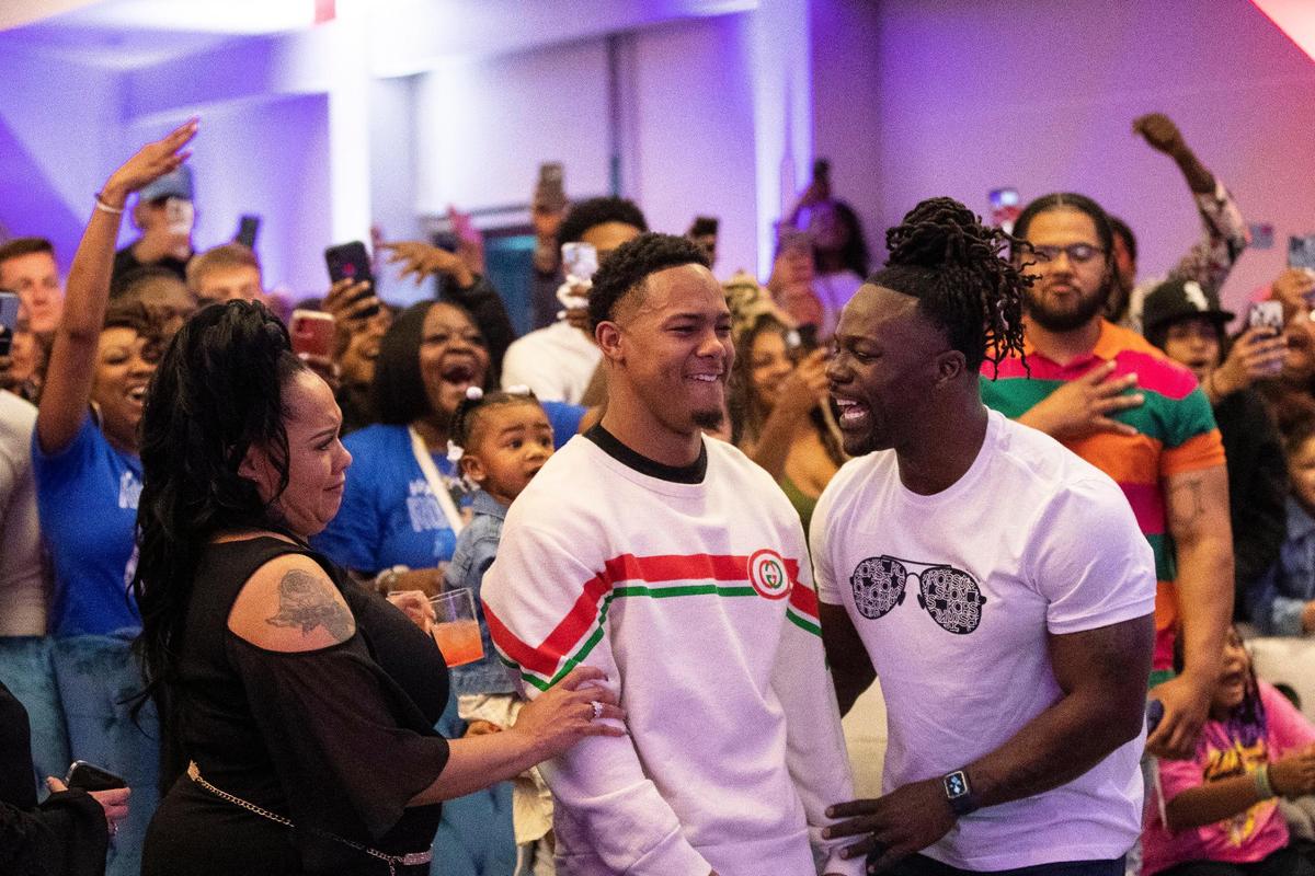 Wan’Dale Robinson, center, reacted to his selection in the second round of the NFL Draft along with his mother Vicki, left, and father, Dale.