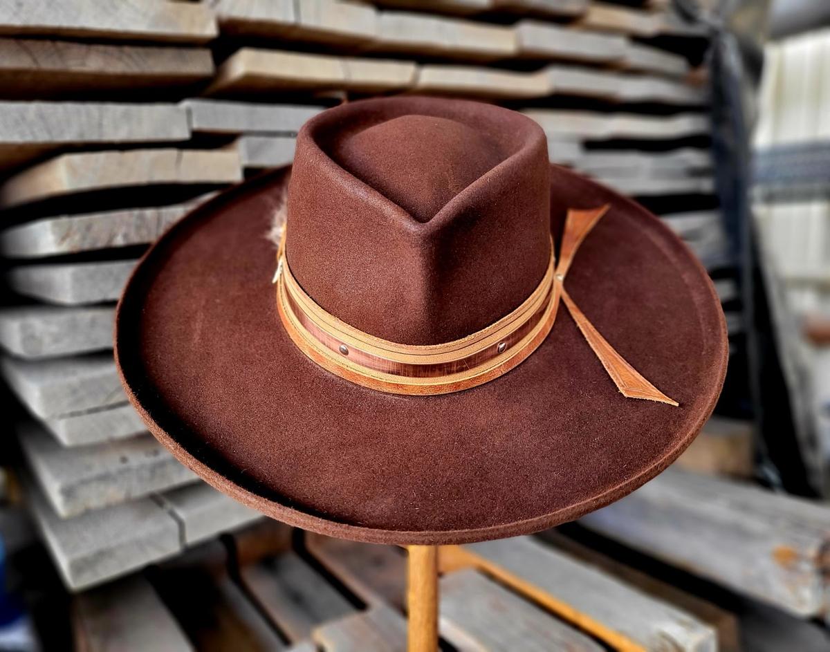 Metal sculptor Tony Higdon has worked metal details like a riveted copper ring into his bespoke hats.