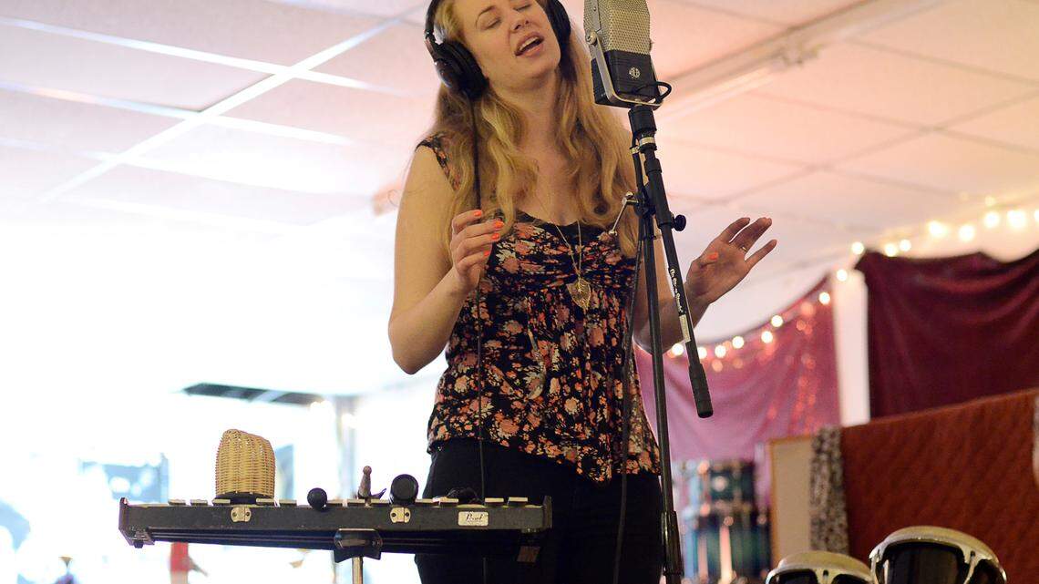 Maggie Lander records backing vocals to the song "Hallelu." The Patrick McNeese Band recorded its latest project, "Dreams in the Light," at Shangri-La Productions in Lexington, Ky. This photo was taken at a session on May 19, 2013. Photo by Rich Copley | staff.