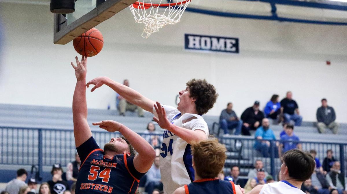 Lexington Catholic’s Reece Potter (34) blocked a shot by Madison Southern’s Brett Erslan (54) during a Boys’ 11th Region Tournament first round basketball game between Lexington Catholic and Madison Southern at Lexington Catholic High School in Lexington, Ky. on Tuesday, Feb. 28, 2023.