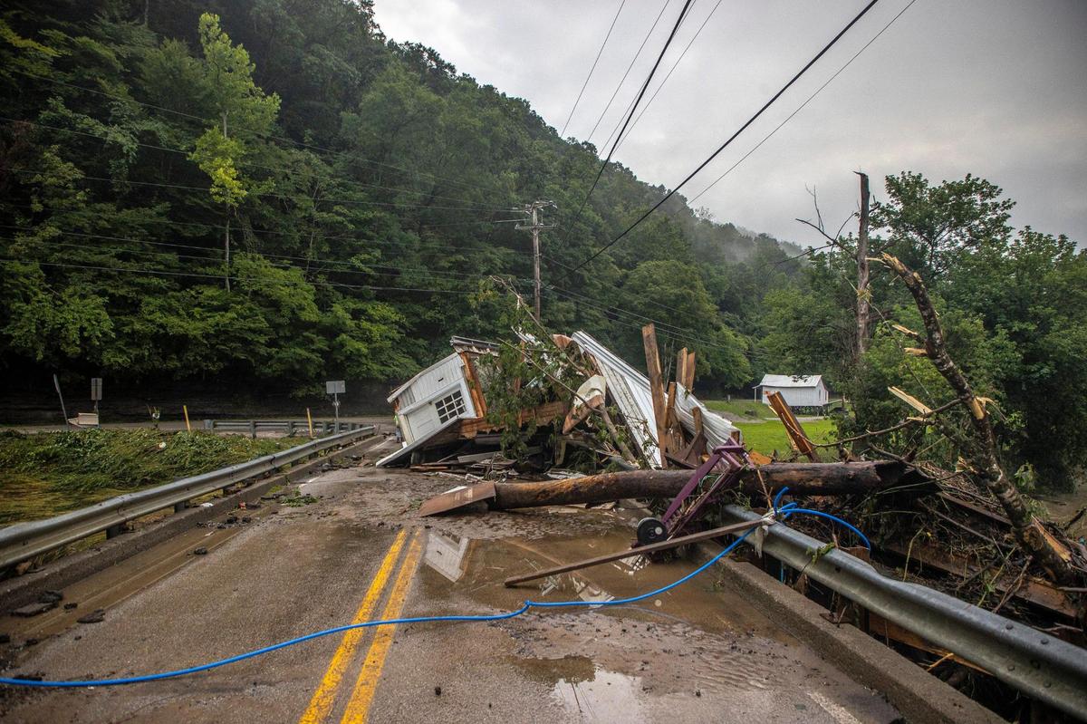A house rests on a bridge on KY-931 near the Whitesburg Recycling Center in Letcher County, Ky., on Friday, July 29, 2022.