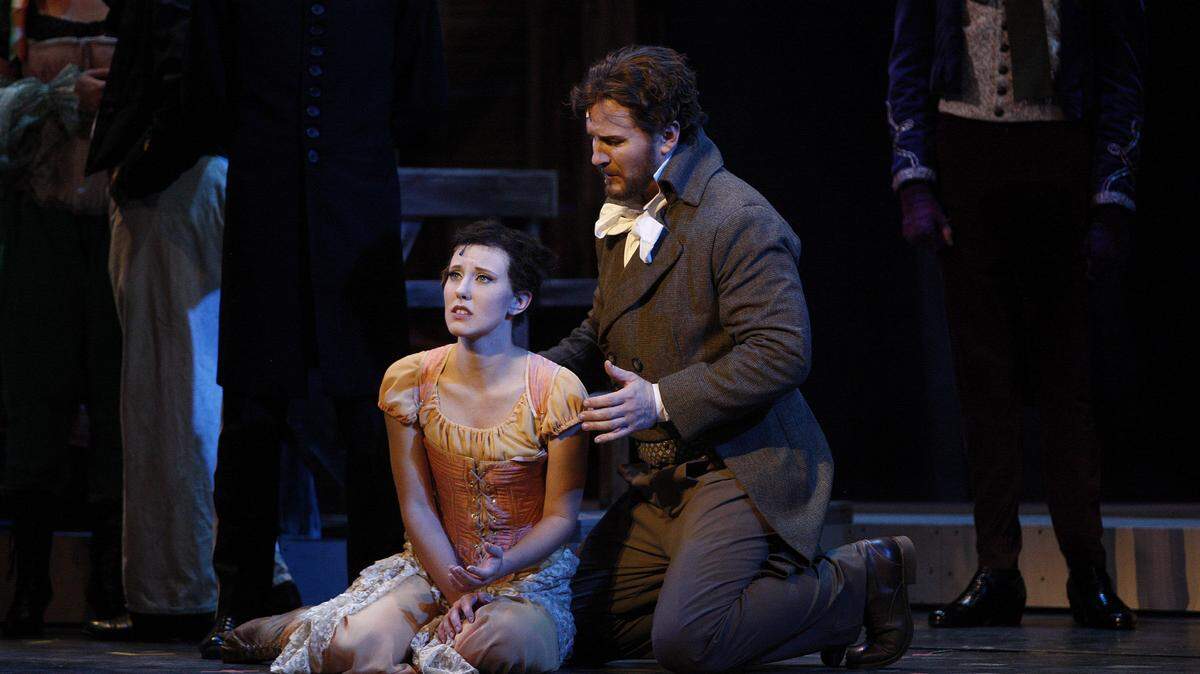 Jessica Bayne, as Fantine, and Gregory Turay, as Jean Valjean, during a dress rehearsal for UK Opera Theatre's production of Les Miserables, under the direction of Richard Kagey, at the Opera House in Lexington, Ky., Tuesday, October 8, 2013. Photo by Matt Goins