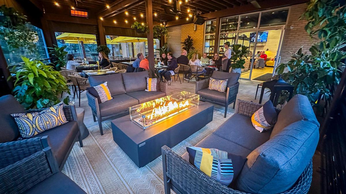 A fireplace in an outside sitting area at Crust. This part of the large dining patio can be enclosed and is heated, making the area usable for all seasons.