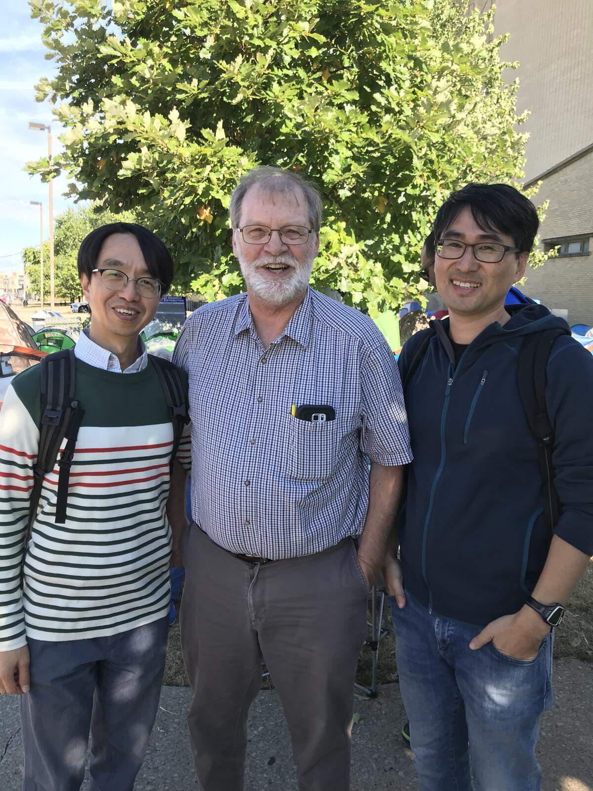 Yong Kon Choi, left, Keith Gilbertson, Yong Kang were at the campout for Big Blue Madness tickets on Wednesday.