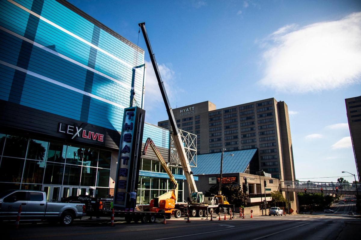 Installation begins on a sign for the new Krikorian Premiere Theatre on Broadway in Lexington, July 26.