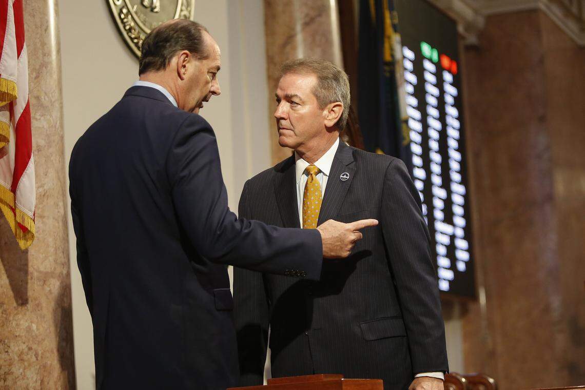 Minority Floor Leader Rep. Rocky Adkins, D-Elliott, speaks with House Speaker Pro Tempore David Osborne, R-Prospect, on the House floor during the General Assembly at the Kentucky State Capitol in Frankfort, Ky., on Monday, January 22, 2018.