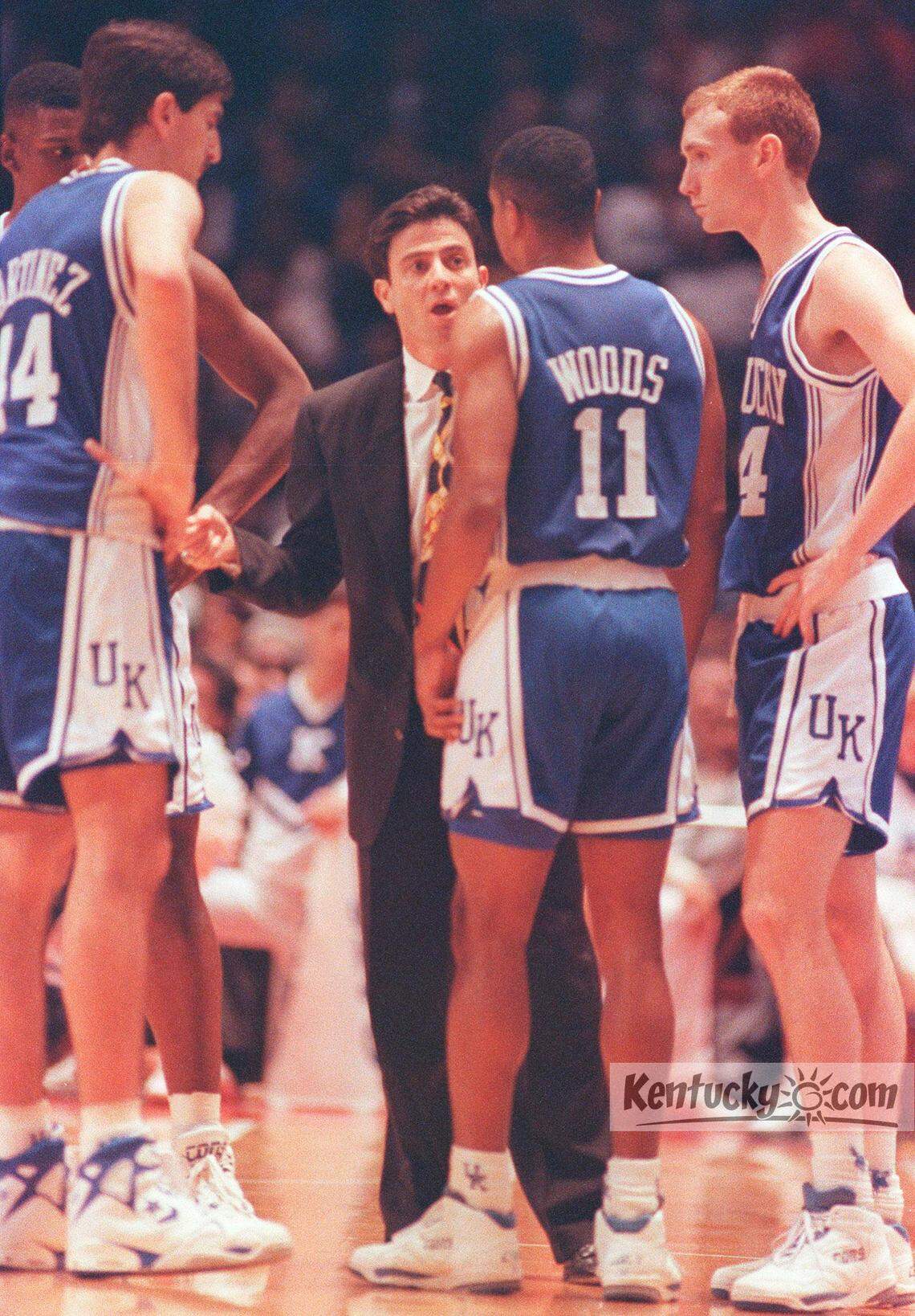 Rick Pitino talked with Kentucky players, from left, Gimel Martinez, Sean Woods and John Pelphrey during UK’s 104-103 overtime loss to Duke in the 1992 NCAA Tournament round of eight.