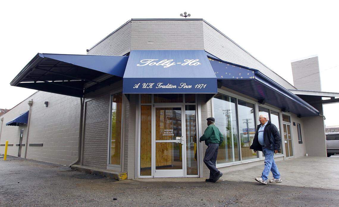 William Million, left, and John Wright, right, entered the new location of the Tolly-Ho, 606 S Broadway in Lexington, Ky., Thursday, May 19, 2011. After being on South Limestone for 25 years, the popular restaurant reopened at 6 a.m. this morning at the new location. Million and Wright were regulars at the old location. Charles Bertram | Staff...