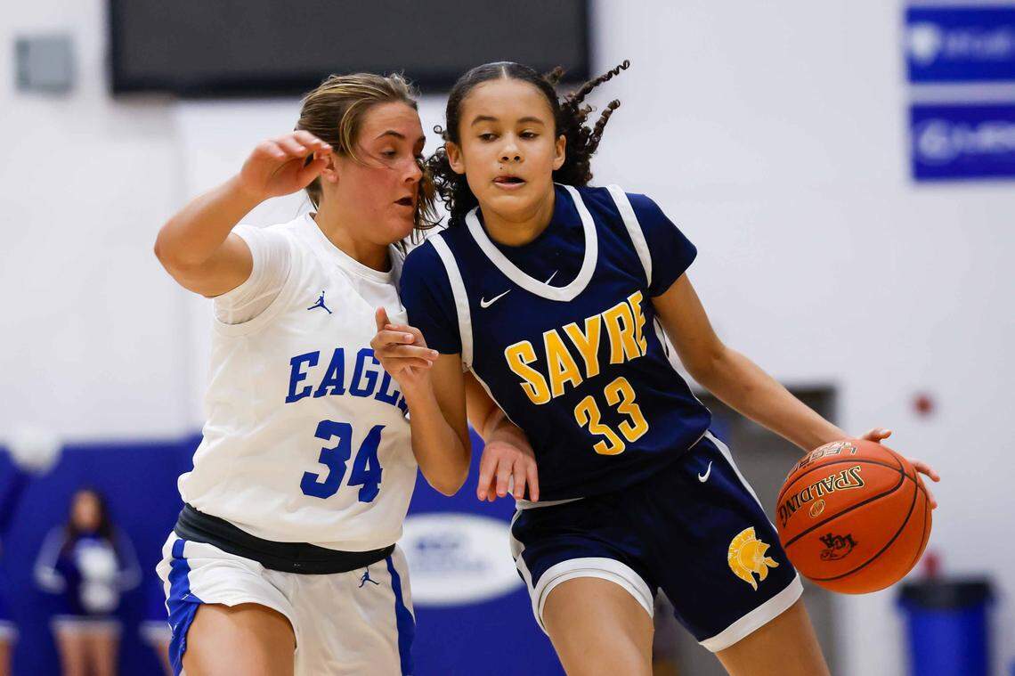 Sayre's Karter Scott (33) dribbles the ball up the court during a high school girls basketball game, on Saturday, Jan. 17, 2026.