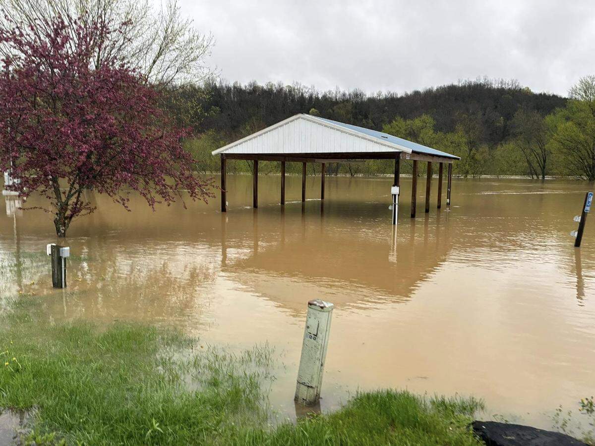 Floodwaters rise Sunday, April 6, 2025, in Butler. Access to Butler was completely shut off Sunday as floodwaters encroached on Pendleton County.