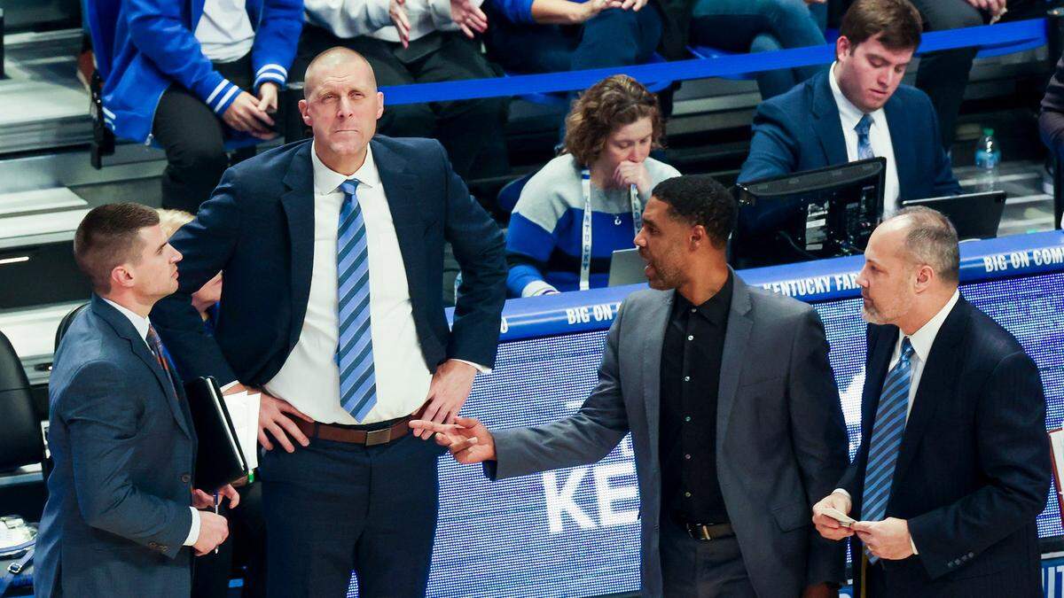 Mark Fox (far right) will return to Kentucky next season as an assistant coach for the Wildcats.