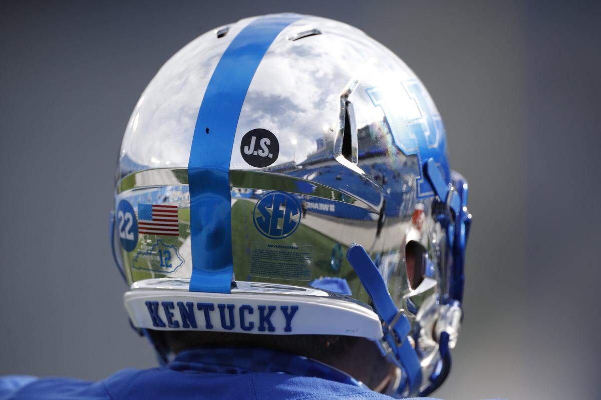 UK players wore “J.S.” stickers on their helmets against Vanderbilt in honor of the late John Schlarman.