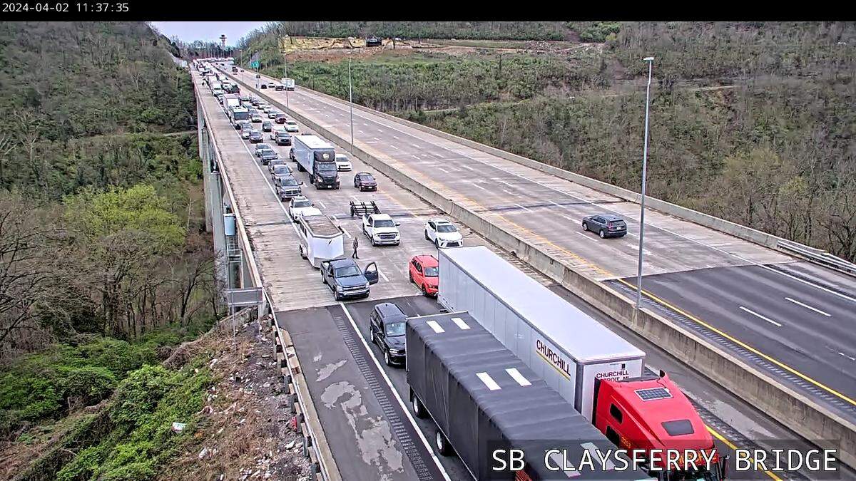 Traffic in the southbound lanes of I-75 at the Clays Ferry Bridge is backed up after the interstate was closed due to storm debris and downed wires in the road.