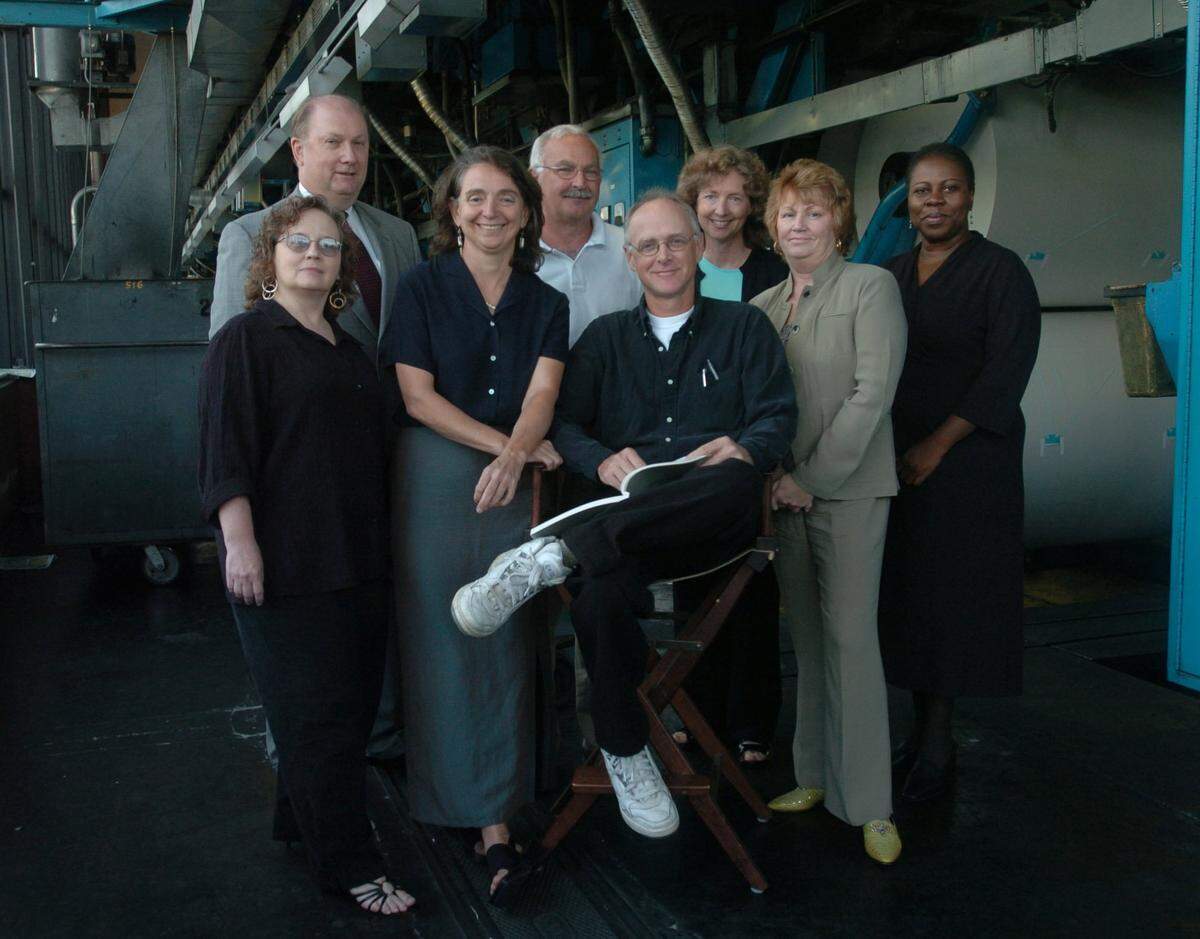 Front from left, Rita Gatton, Jaci Carfagno, Joel Pett, and Marilyn  Thompson, second row, from left, Tim Kelly, Larry Dale Keeling, Jamie Lucke,  and Vanessa Gallman, the Lexington Herald-Leader Editorial Board in the  pressroom, Lexington, Ky., Wednesday, September 7, 2005.