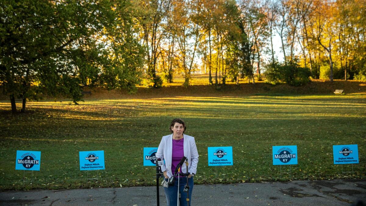 Amy McGrath, Kentucky Democratic candidate for the U.S. Senate, speaks to members of the media before voting during early voting at the Scott County Public Library in Georgetown, Ky., on Tuesday, Oct. 13, 2020.