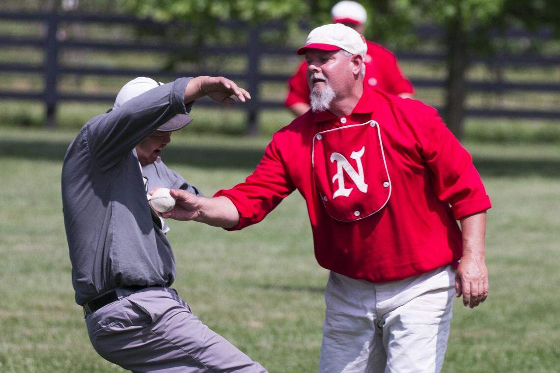 John Santos “One Pocket” Losantiville Black Stockings was tagged out at first by Todd Mattingly “Rabbit” In a vintage baseball game set in the 1860’s The Norwood Highlanders defeated the Losantiville Black Stockings 16-4 at Waveland Historic Site on Sunday May 17, 2015, Lexington, Ky. Photo by Mark Mahan