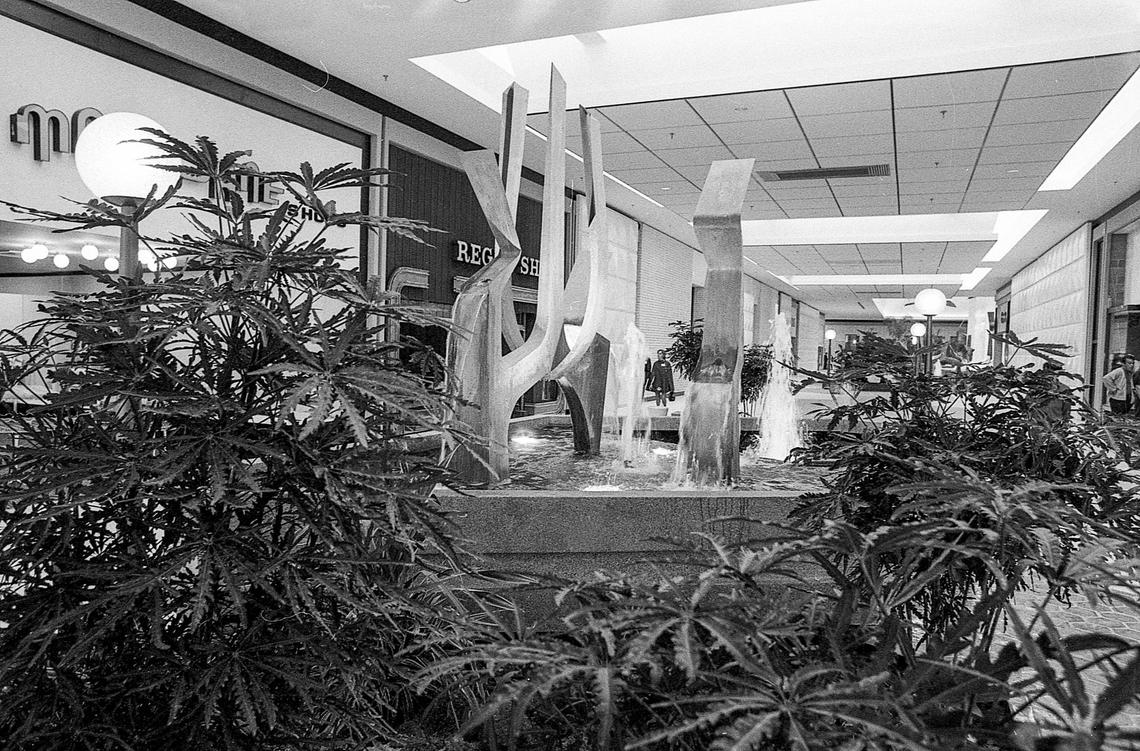 One of the four fountains and metal sculptures inside the new Fayette Mall, taken days before it opened on Oct. 11, 1971 in Lexington, Ky. Water in all four fountains was softened to prevent scum from forming. At left is a Merle Norman Cosmetics store and Regal Shoes, a men’s shoe store.