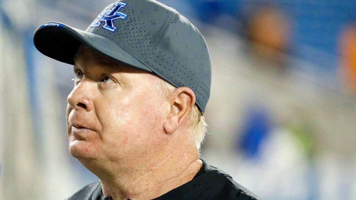 Kentucky head coach Mark Stoops walks off the field following a 33-27 loss against Tennessee at Kroger Field.
