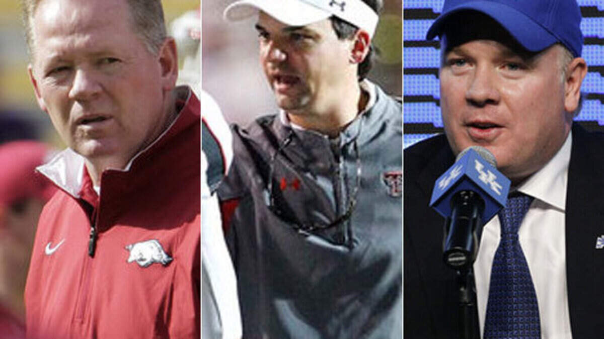 New Western Kentucky Coach Bobby Petrino, left, Kentucky's new offensive coordinator Neal Brown, center, and new Kentucky Coach Mark Stoops