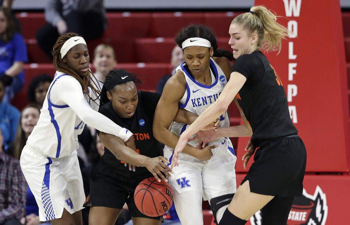 Kentucky’s Rhyne Howard, left, and Ogechi Anyagaligbo, second from right, struggle for a rebound with Princeton’s Sydney Jordan and Bella Alarie, right, during the teams’ NCAA Tournament matchup in 2019.