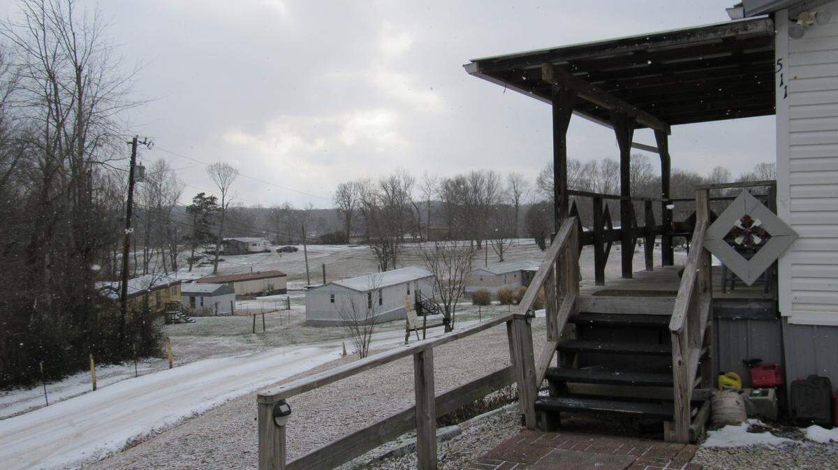 The doublewide mobile home on the right is where London police fatally shot Doug Harless Dec. 23, 2024, while trying to serve a warrant. The singlewide mobile home down the hill, at the center of the photo, has numbers that allegedly match the warrant, but public records identify the house on the right with an address that matches the warrant.