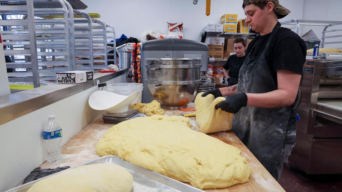 Heather Konkle kneads dough at Jeff’s Donuts, Thursday, Jan. 23, 2025, in Lexington, Ky. Every doughnut is handmade daily at the location, which is open 24 hours.
