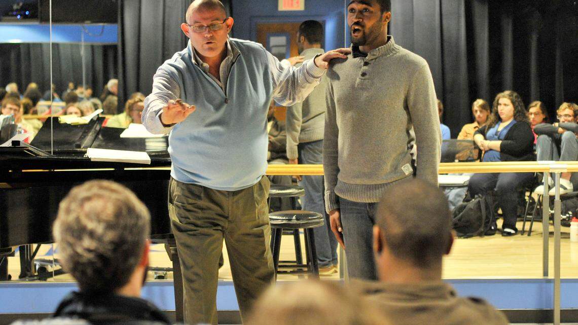 Ronan Tynan, left, worked with Jermaine Brown Jr. during a class on Tuesday. Tynan says the students' training makes the work easy.  