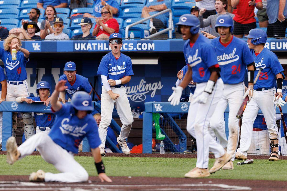 Madison Central celebrates John Girard scoring a run during the fifth inning Thursday night. The Indians threatened again in later innings but could never tie the game.