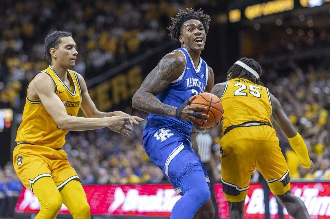 Kentucky center Amari Williams (22) looks to shoot the ball in front off Missouri guards Trent Pierce (11) and Mark Mitchell (25) during Saturday’s game at Mizzou Arena in Columbia, Mo.