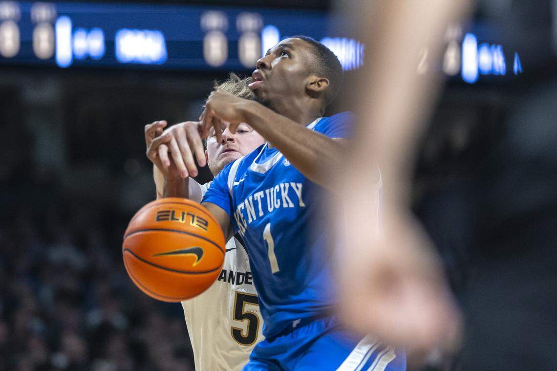 Vanderbilt guard Tyler Nickel (5) knocks the ball away from Kentucky guard Lamont Butler (1) during Saturday’s game at Memorial Gymnasium in Nashville, Tennessee.