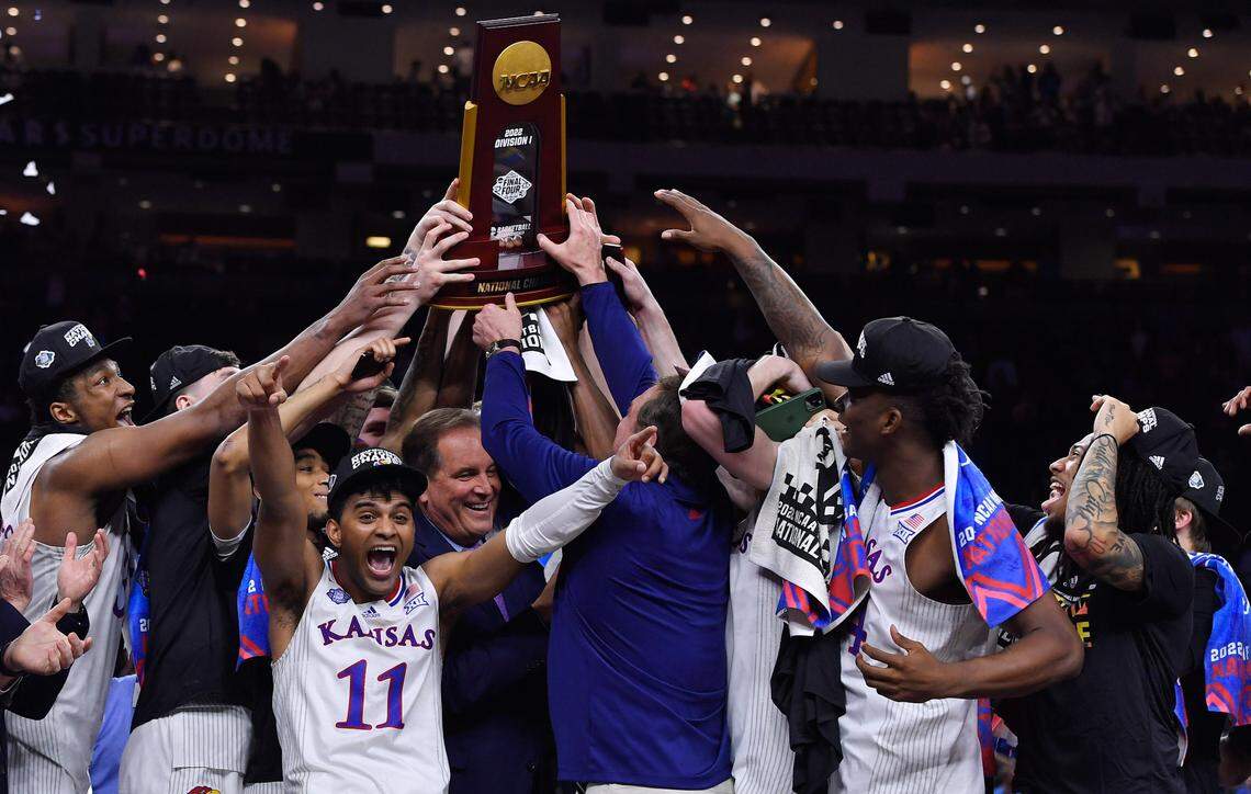 The Kansas Jayhawks raise the NCAA championship trophy after defeating North Carolina 72-69 on Monday night in New Orleans.