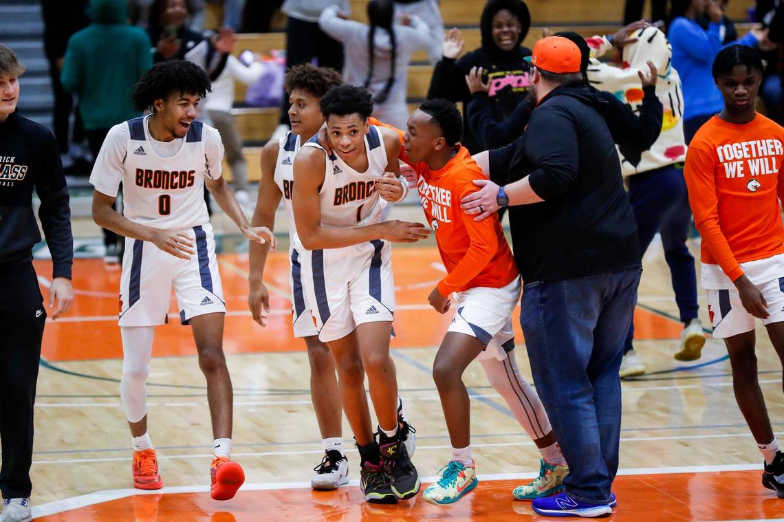 Frederick Douglass’s Armelo Boone (1) celebrates scoring the game-winning basket against Madison Central on Friday night in Lexington.
