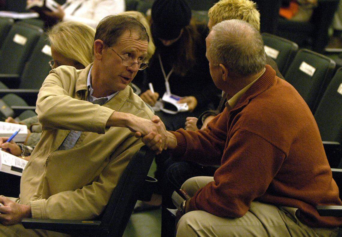 Seth Hancock, left, owner of Claiborne Farm, was consigner of Hip 173, Madcap Escapade, shakes hands with Bruce Lunsford, owner of Madcap Escapade after it was sold for $6 million at the opening day of the 2006 November Breeding Stock Sale on Nov. 6, 2006 at Keeneland Sales  Pavilion in Lexington. 