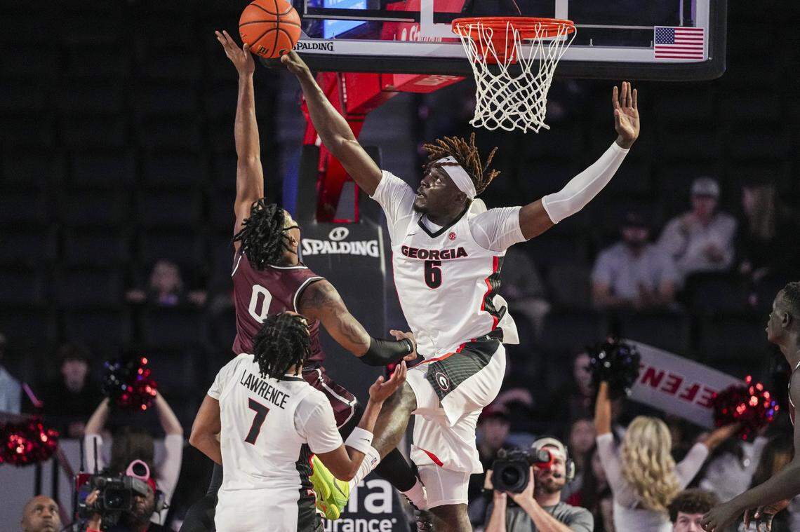 Nov 19, 2024; Athens, Georgia, USA; Georgia Bulldogs center Somto Cyril (6) blocks a shot by Alabama A&M Bulldogs guard AC Bryant (0) during the first half at Stegeman Coliseum. Mandatory Credit: Dale Zanine-Imagn Images