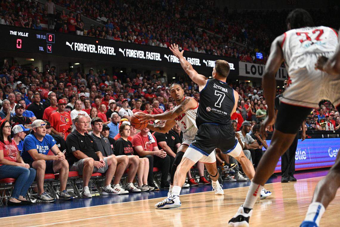 La Familia’s Nate Sestina defends The Ville’s Peyton Siva in the first half of Monday night’s game in Freedom Hall.