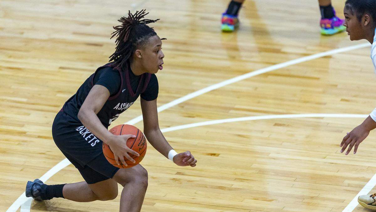 Assumption's Ashlinn James (31) drives the ball against Danville Christian's Amauri Blackford (24) during their game at Danville Christian Academy on Jan. 16. James is the 2025 Herald-Leader preseason player of the year.