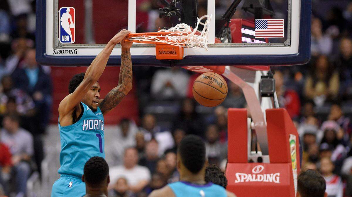 Charlotte Hornets guard Malik Monk dunked against the Washington Wizards on March 31, 2018, in Washington. The former University of Kentucky star scored 23 points in his NBA Summer League debut on Friday.