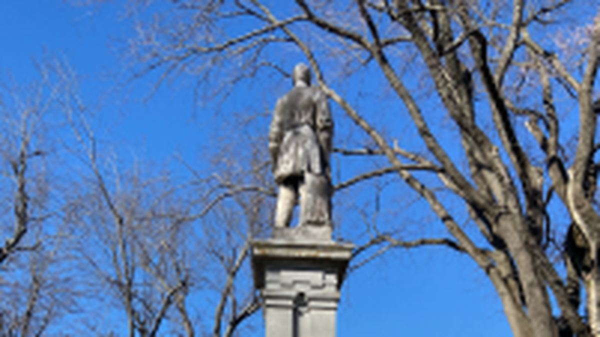 A statue of Confederate Captain R.D. Logan sits in the cemetery overlooking the Centre College campus.