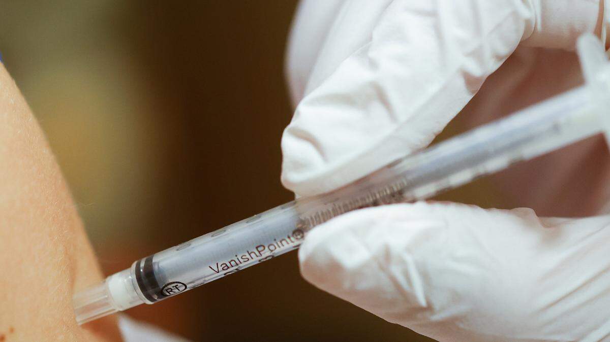 A child receives his coronavirus vaccine at a University of Kentucky clinic on Nov. 3, 2021