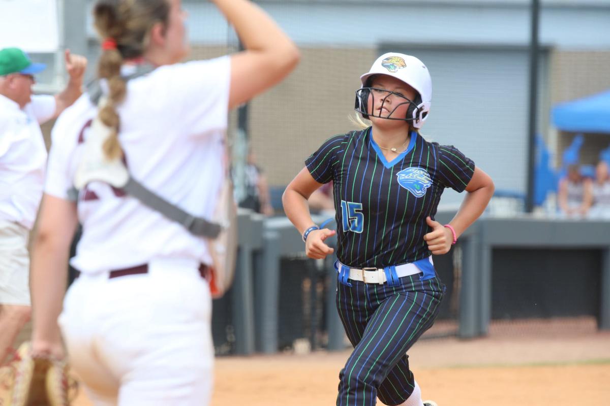 North Laurel’s Bella Finley crosses home plate during the softball state semifinals against Assumption.
