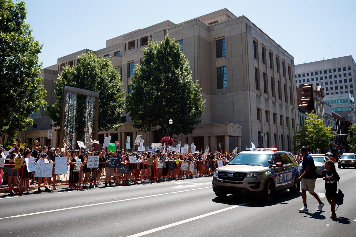 Protesters chant during a women’s rights rally at a Fourth of July parade in protest of the Supreme Court’s decision to overturn Roe v. Wade on Monday, July 4, 2022, on Main Street in Lexington, Kentucky.