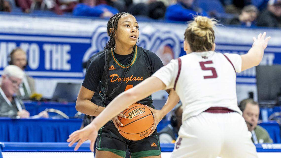 Frederick Douglass' Tamia Waide (4), left look for an outlet under pressure from Henderson County's Adalyn Gish (5) during a first-round win over Henderson County in the 2026 Clark's Pump-N-Shop Girls' Basketball Sweet 16, Wednesday, March 11, 2026 at Rupp Arena in Lexington, Ky.