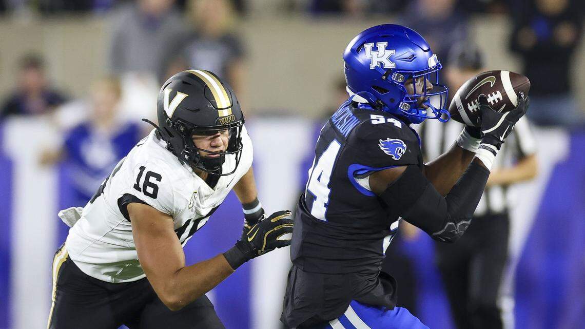 Kentucky linebacker D’Eryk Jackson (54) intercepts a pass intended for Vanderbilt tight end Cole Spence (16) during Saturday’s game against Vanderbilt.