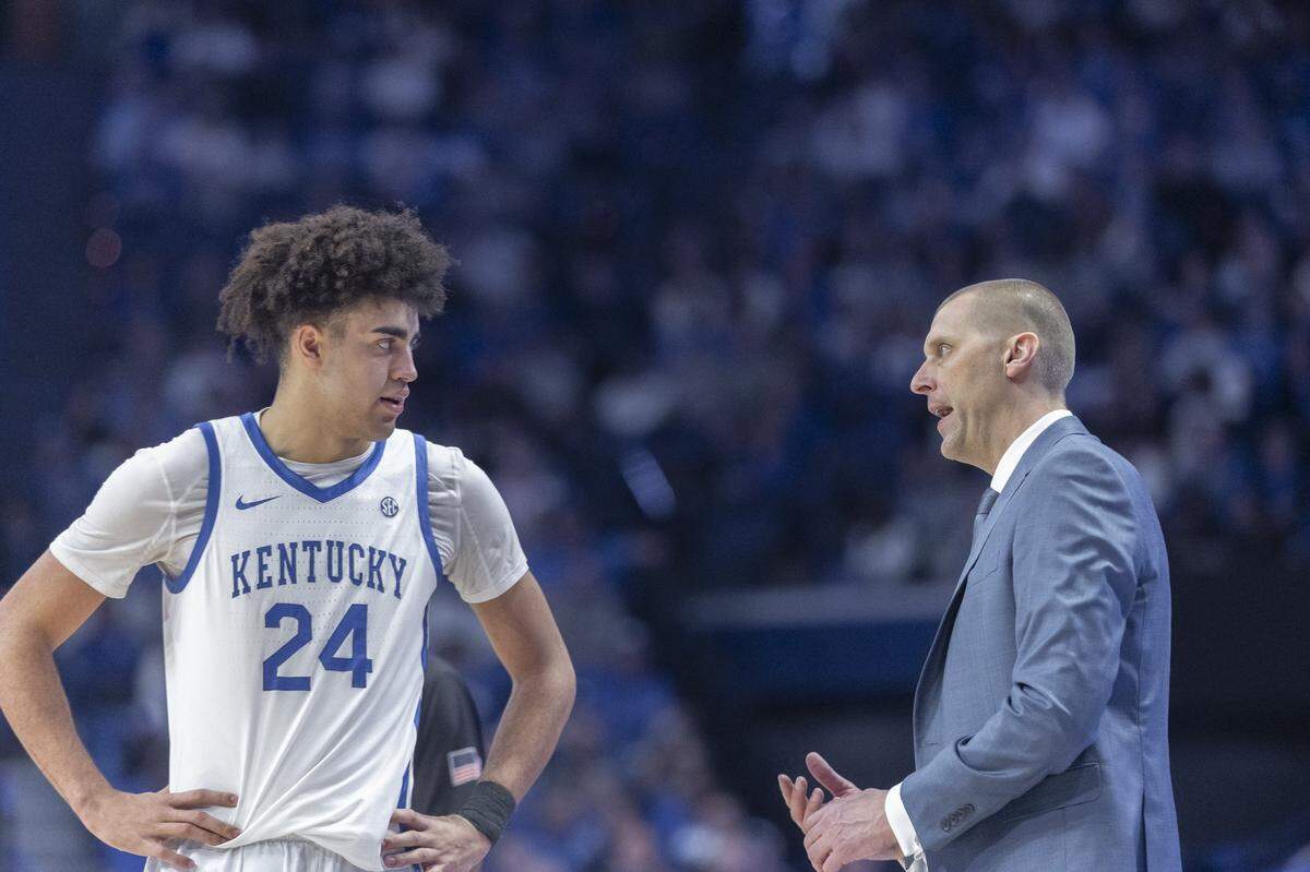 Kentucky basketball coach Mark Pope, right, talks to freshman center Malachi Moreno during a game against Mississippi State at Rupp Arena on Saturday.