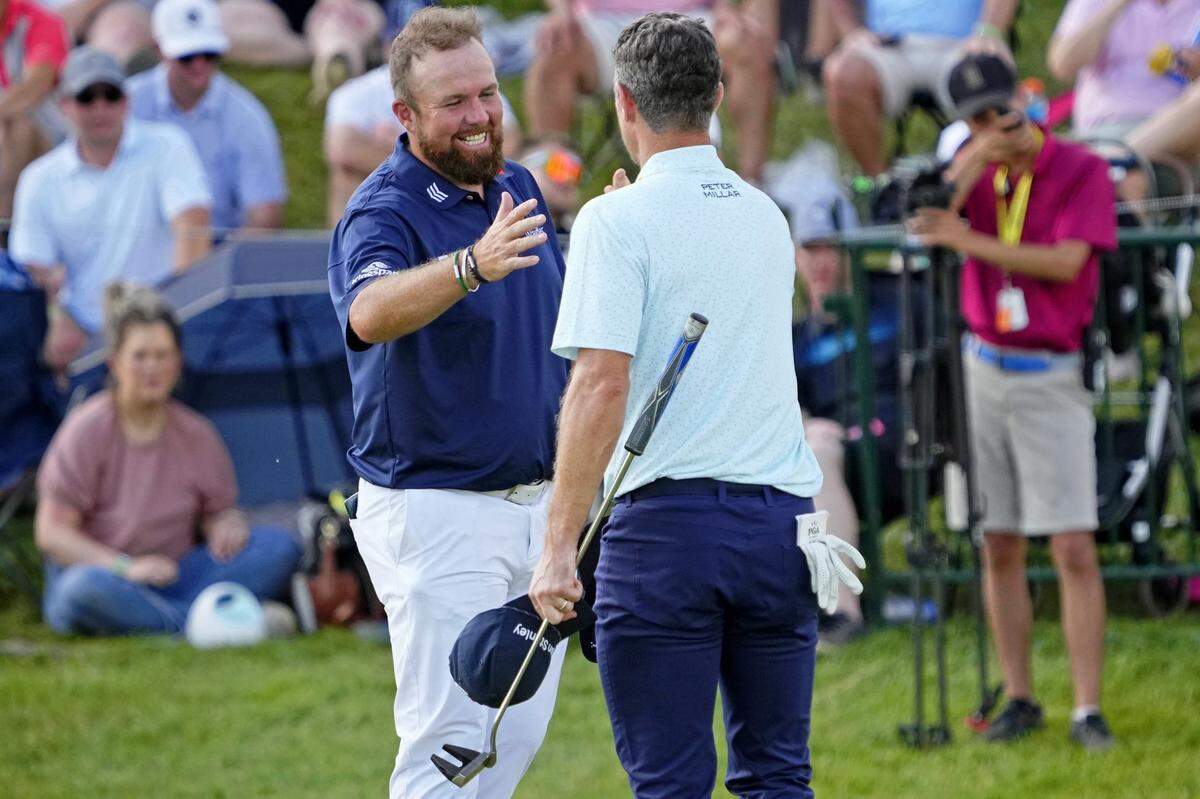 Shane Lowry is congratulated by Justin Rose after shooting a 62 during the third round of the PGA Championship at Valhalla Golf Club in Louisville on Saturday.
