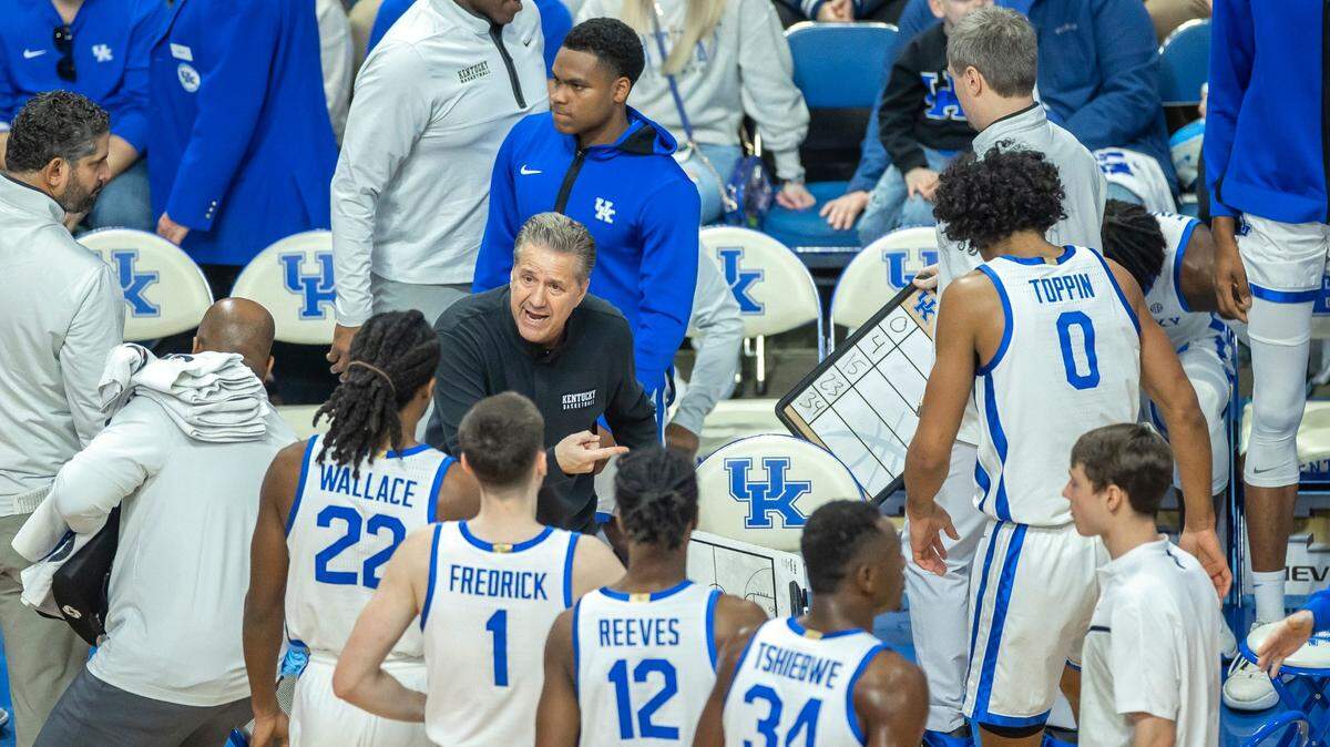 Kentucky Wildcats head coach John Calipari talks to his players during a timeout in a game against the Texas A&M Aggies at Rupp Arena in Lexington, Ky., on Saturday, Jan. 21, 2023.